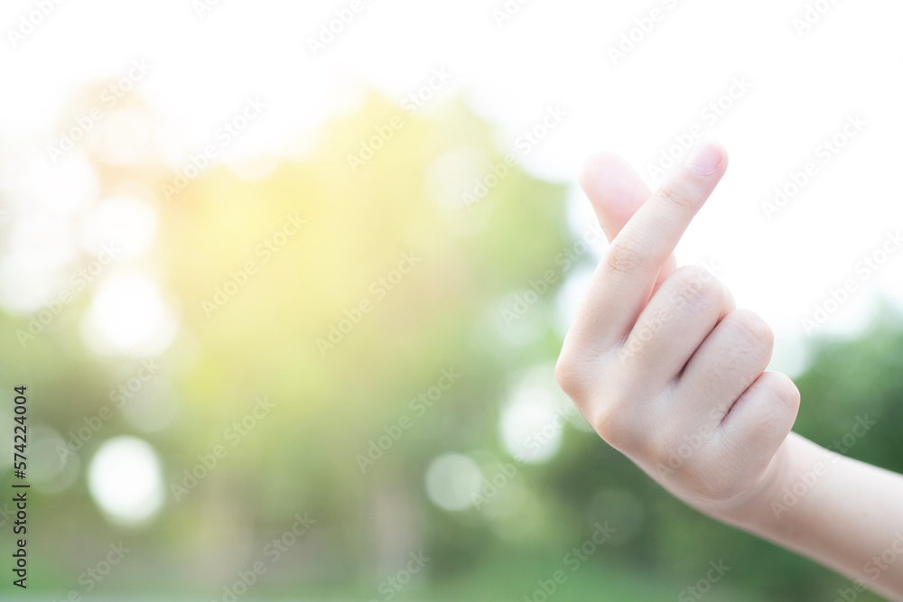 Small heart hands isolated on nature background. This image can be used for the world of love or valentine concept. Small heart hands isolated on nature background. This image can be used for the world of love or valentine concept.