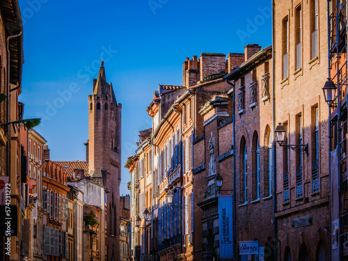 Fototapeta Naklejka Na Ścianę i Meble -  View on the Rue du Taur and Notre Dame du Taur church and typical facades of Toulouse, in the south of France (Haute Garonne)