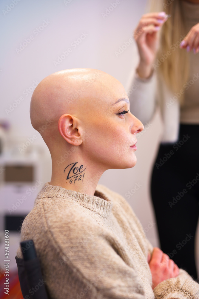 girl with alopecia sitting in makeup room
