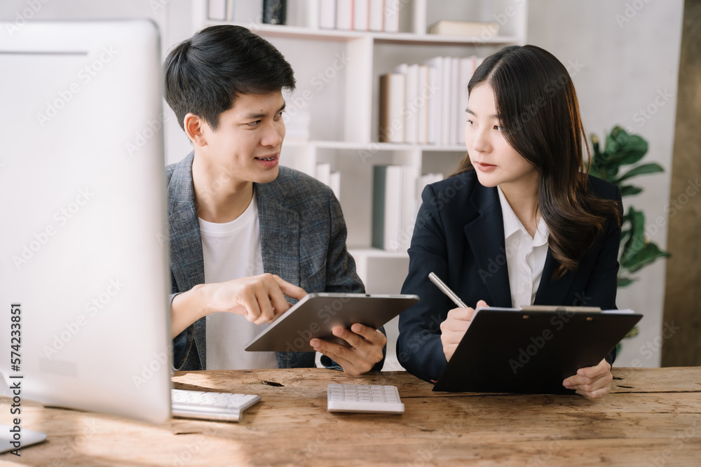Professional investor working new start up project. Finance managers meeting.using laptop and digital tablet computer in office. Professional investor working new start up project. Finance managers meeting.using laptop and digital tablet computer in office.