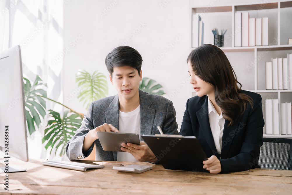 Professional investor working new start up project. Finance managers meeting.using laptop and digital tablet computer in office. Professional investor working new start up project. Finance managers meeting.using laptop and digital tablet computer in office.