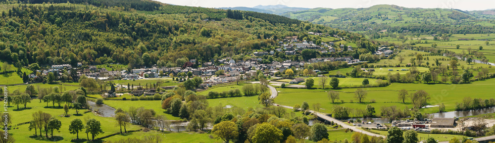 Panoramic aeriial landscape view of farms and hills above the town of Corwen North Wales