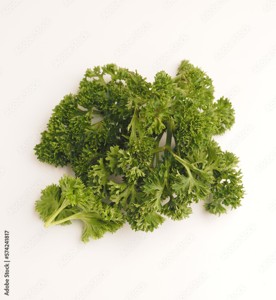 Curly parsley on a white background Curly parsley on a white background