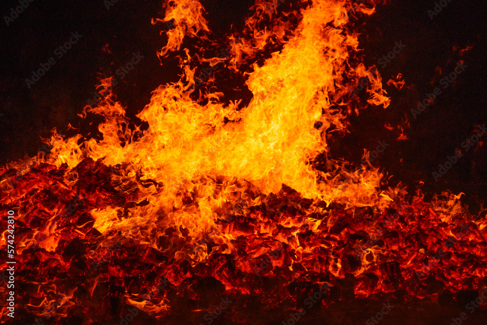 Fire by night. Flames and embers. Hot and inferno Fire by night. Flames and embers. Hot and inferno