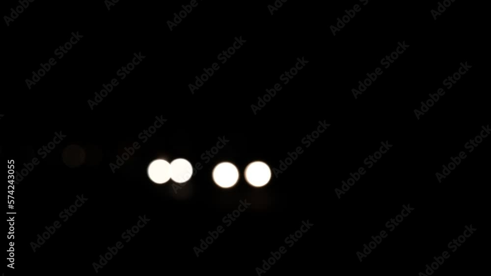 car light at night. car light bokeh at night. moving defocused light background car light at night. car light bokeh at night. moving defocused light background