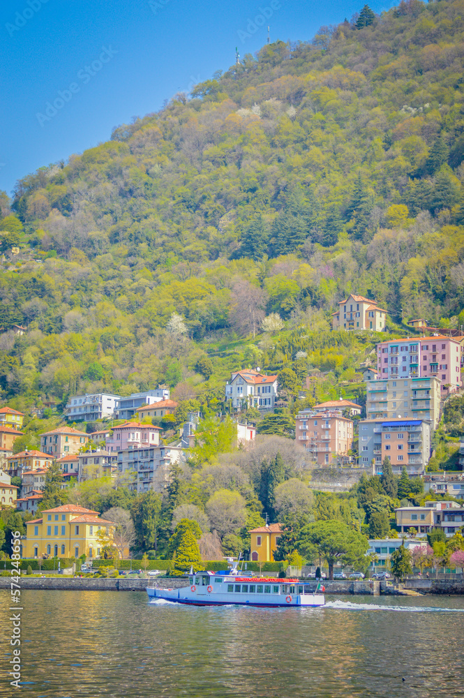 Obraz premium Spring in Italy, Lombardy, Milano, Como lake and city. Landscape view on hills, park, old town and water, with some interesting details, close up and panoramic.