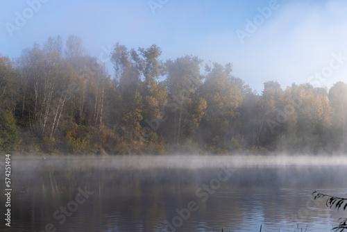 Fog-covered river in the autumn season