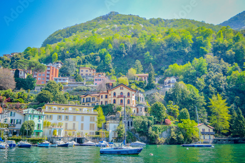 Fototapeta Naklejka Na Ścianę i Meble -  Spring in Italy, Lombardy, Milano, Como lake and city. Landscape view on hills, park, old town and water, with some interesting details, close up and panoramic.