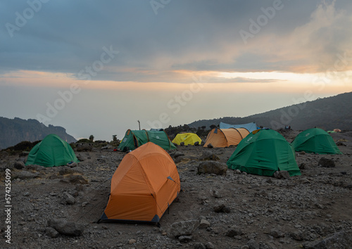 Camping in the Clouds - Tents on a Mountain Peak at Sunset