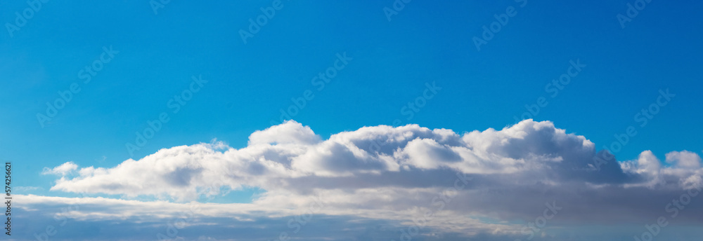 White curly clouds in the blue sky, panorama