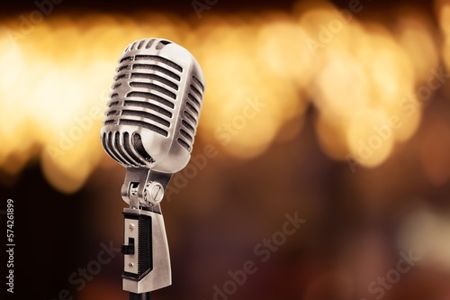 Classic retro steel microphone on background