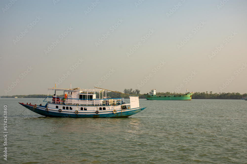 11th February, 2023, Sundarban, West Bengal, India: A tourist boat with tourists enjoying boat safari on river at Sundarban Tiger reserve, India.