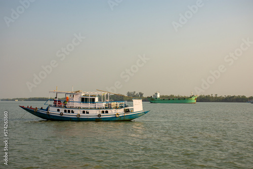 11th February, 2023, Sundarban, West Bengal, India: A tourist boat with tourists enjoying boat safari on river at Sundarban Tiger reserve, India.