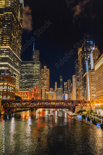 Chicago lights at night, skyline of city view from bridge on summer evening