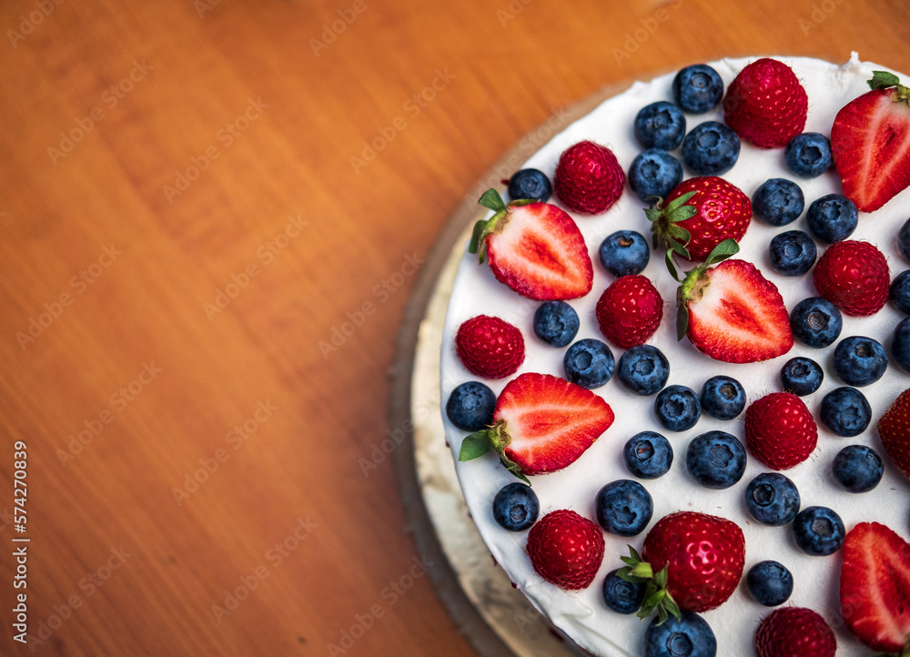 strawberry and blueberry cake on a plate strawberry and blueberry cake on a plate