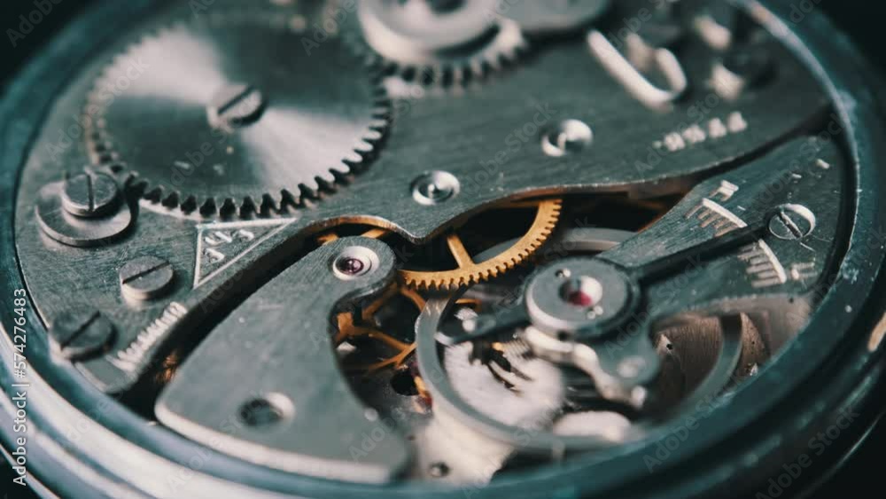 Mechanism of vintage stopwatch closeup. Round clock watch mechanism