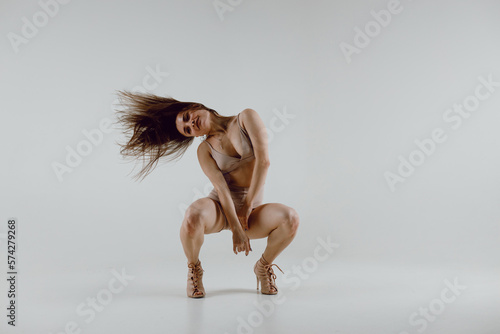 Fototapeta Young woman dancer dancing high heels dance