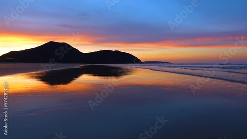 Landscape at sunset on the beach of Berria near the town of Santoña. Natural Park of the Marshes of Santoña, Victoria, Noja and Joyel. Cantabrian Sea. Cantabria. Spain. Europe photo