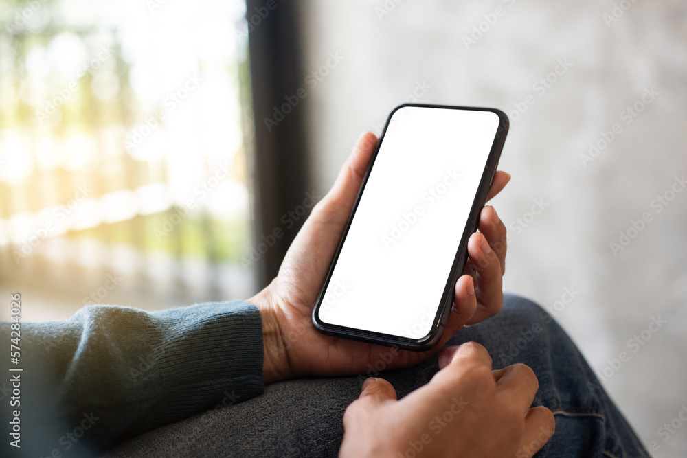 cell phone blank white screen mockup.hand holding texting using mobile on desk at office.background empty space for advertise.work people contact marketing business,technology