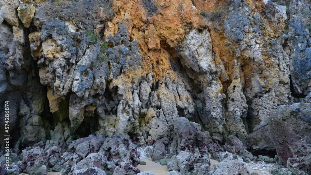 Details of the rocks of the Berria beach at sunset near the town of Santoña. Natural Park of the Marshes of Santoña, Victoria, Noja and Joyel. Cantabrian Sea. Cantabria. Spain. Europe Details of the rocks of the Berria beach at sunset near the town of Santoña. Natural Park of the Marshes of Santoña, Victoria, Noja and Joyel. Cantabrian Sea. Cantabria. Spain. Europe