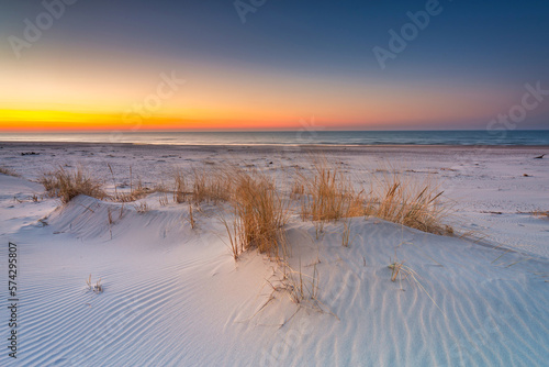 Beautiful scenery of the Baltic Sea beach at sunset  Slowinski National Park  Leba. Poland