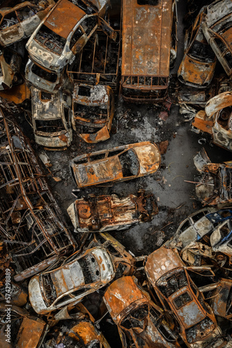 burned civilian cars in Irpin   photo