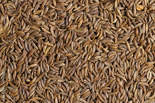 a large number of cumin seeds that are used as spices in cooking