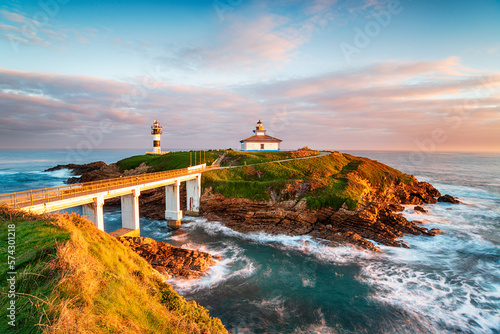 The beautiful Illa Pancha and it's lighthouse at Ribadeo photo