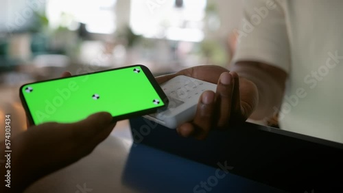 Close Up Green Screen Smart Phone with Customer Paying on Digital Payment Terminal In a Store