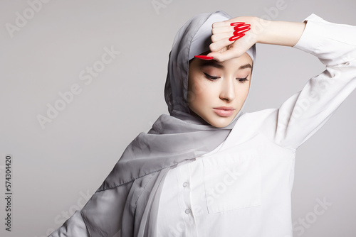 beautiful islamic young woman with long Nails. beauty girl in hijab photo