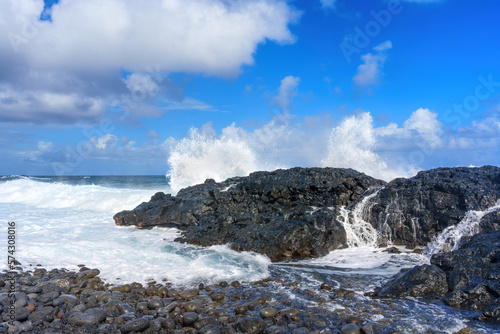 Ocean Waves Crashing Against Hawaii's Rocky Shoreline