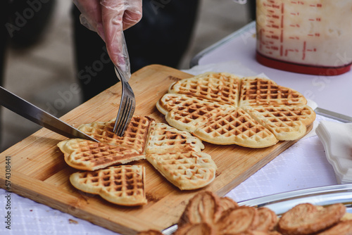 Preparing waffle or waffles with jam, dish made from leavened butter or dough that is cooked between two plates that are patterned to give a characteristic size, shape, and surface impression