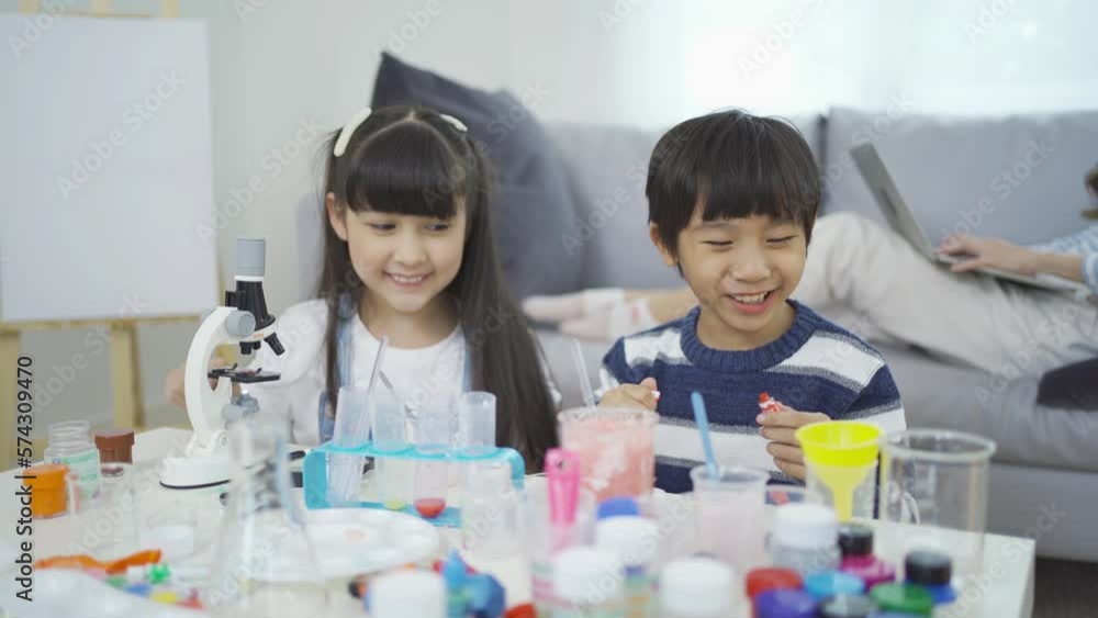 A group of Asian students kids study, learn on test tube in lab or laboratory in school, medical, chemistry. Experiment science. Education in classroom. People lifestyle A group of Asian students kids study, learn on test tube in lab or laboratory in school, medical, chemistry. Experiment science. Education in classroom. People lifestyle