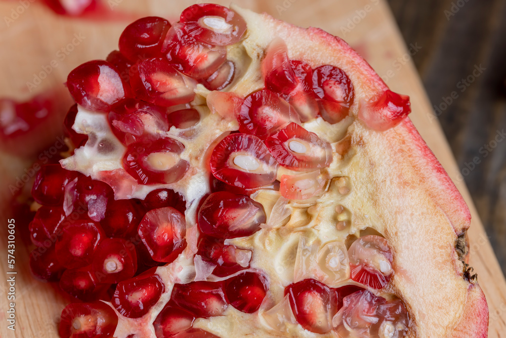 Ripe pomegranate with red grains for dessert Ripe pomegranate with red grains for dessert