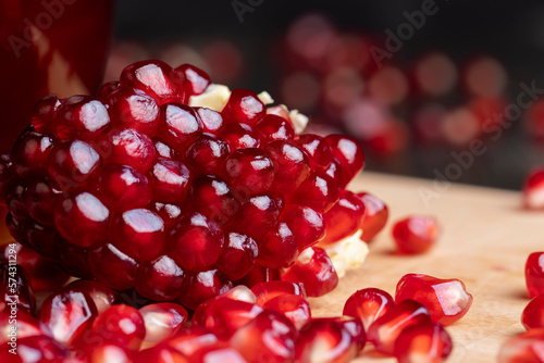 red pomegranate without peel with lots of sweet seeds photo