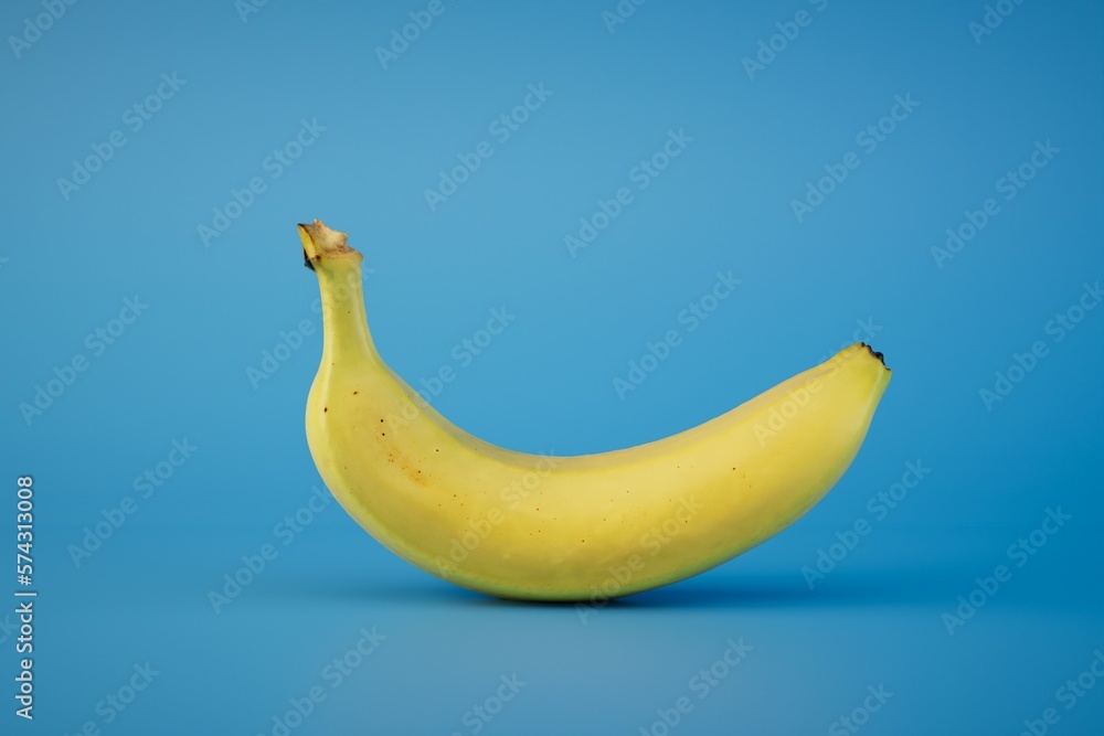 a large banana on a blue background. 3D render a large banana on a blue background. 3D render