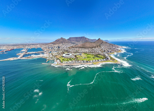 Rocky island overhead with waves crashing on the shore