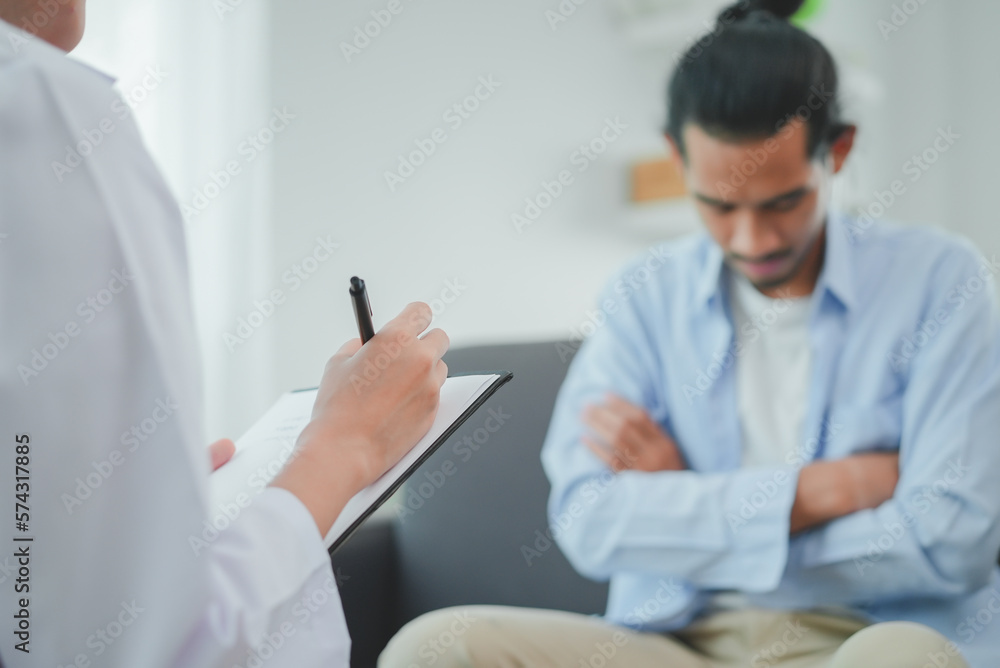 Men talk with a psychologist during talking therapy stressed mental health at office Men talk with a psychologist during talking therapy stressed mental health at office