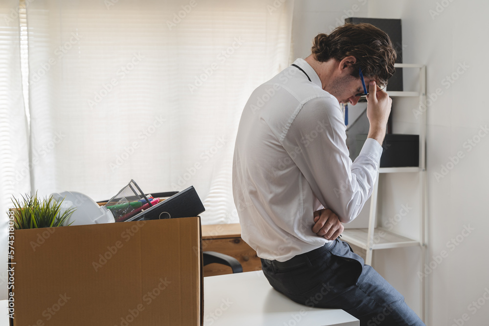 lay off workers. Sad fired Businessman feeling stress after losing his job in the office.