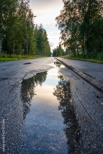Reflections in water on a road. Finland