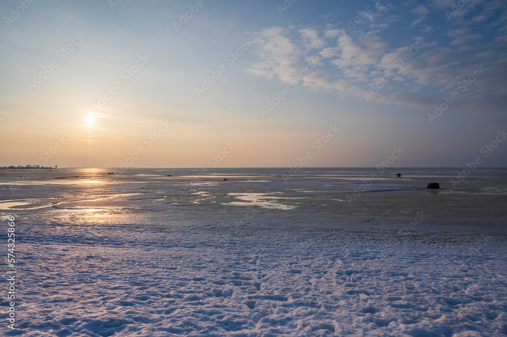 sunset over the frozen sea in winter. Kalajoki, Finland