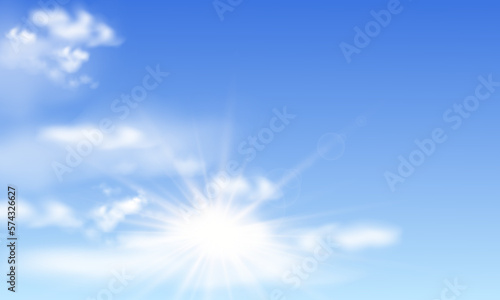 Blue sky with sun ray and white clouds