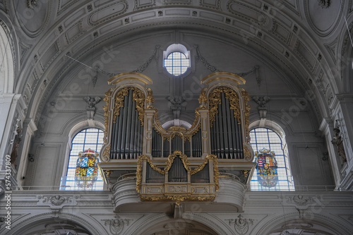 Magnificent opulent splendid Bavarian baroque church cathedral basilica interiors with stucco, murals, altar, Pilars, ceiling paintings, gold, wood domes nave