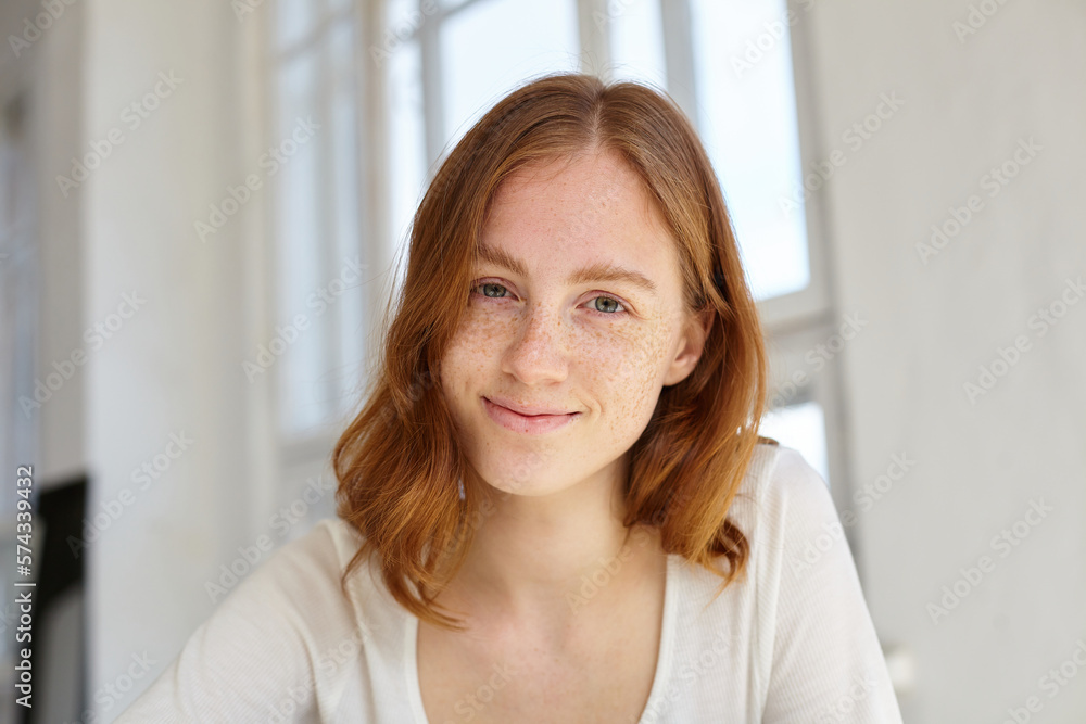 pretty happy young ginger female looking into camera with broad smile pretty happy young ginger female looking into camera with broad smile