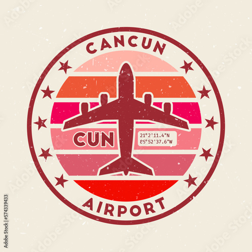 Cancun airport insignia. Round badge with vintage stripes, airplane shape, airport IATA code and GPS coordinates. Artistic vector illustration. photo