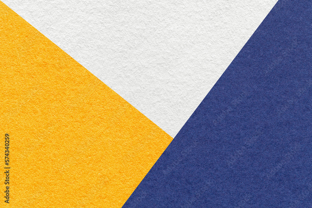 Texture of craft white, yellow and navy blue shade color paper background, macro. Vintage abstract cardboard Texture of craft white, yellow and navy blue shade color paper background, macro. Vintage abstract cardboard