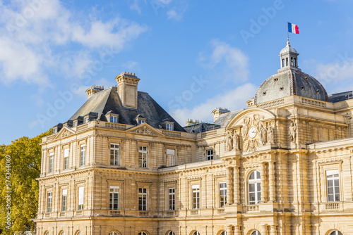 French flag waving on the Luxembourg Palace in the Jardin du Luxembourg garden in Paris France, home of the French Senate photo