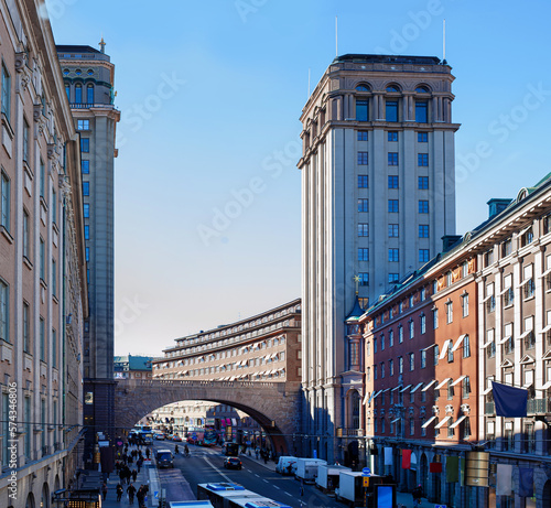 arch bridge between two high-rise buildings across the highway to stockholm