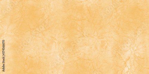Textured background of old raw cement or yellow plaster wall with stains and cracks