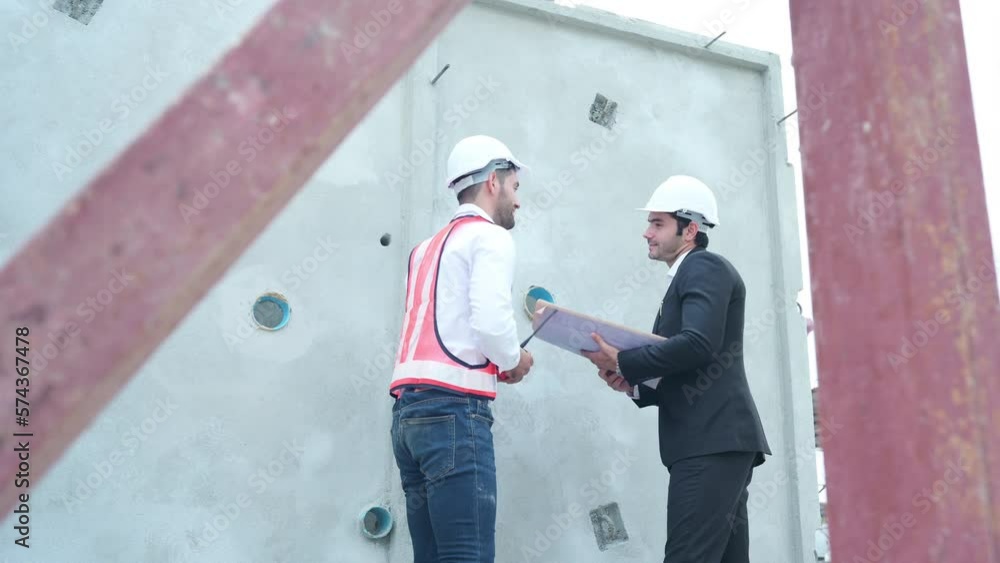 Architects a visit to the construction site. Ready to talk the progress of construction projects in the construction area with construction supervision engineers. Architects a visit to the construction site. Ready to talk the progress of construction projects in the construction area with construction supervision engineers.